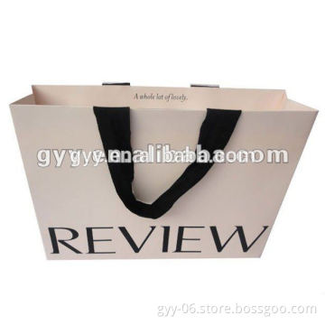 White Garment paper bag with hidden handle